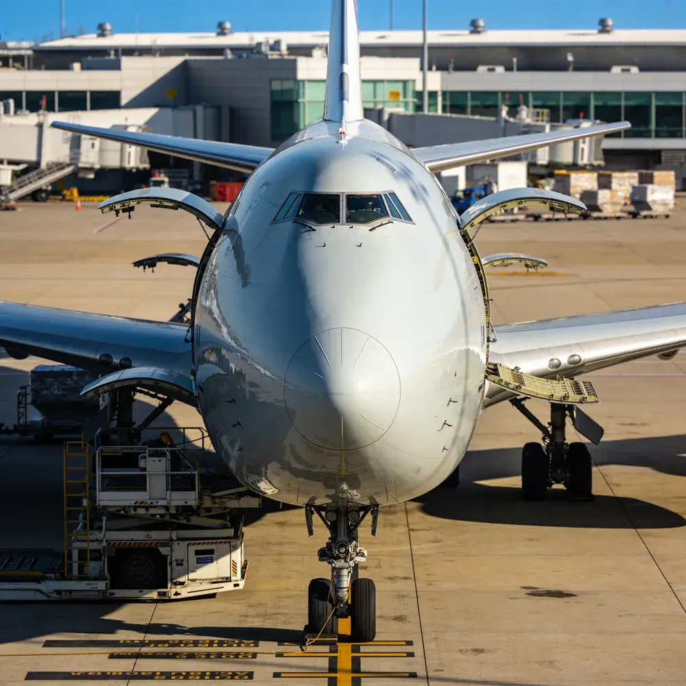 Widebody freighter aircraft being loaded at the terminal apron